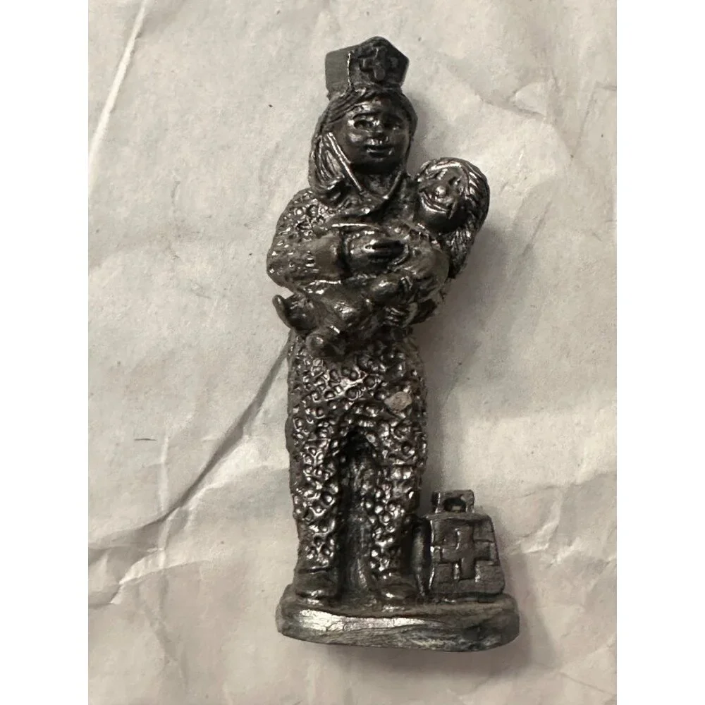 Michael Ricker Pewter Nurse Sculpture Holding Child Christmas